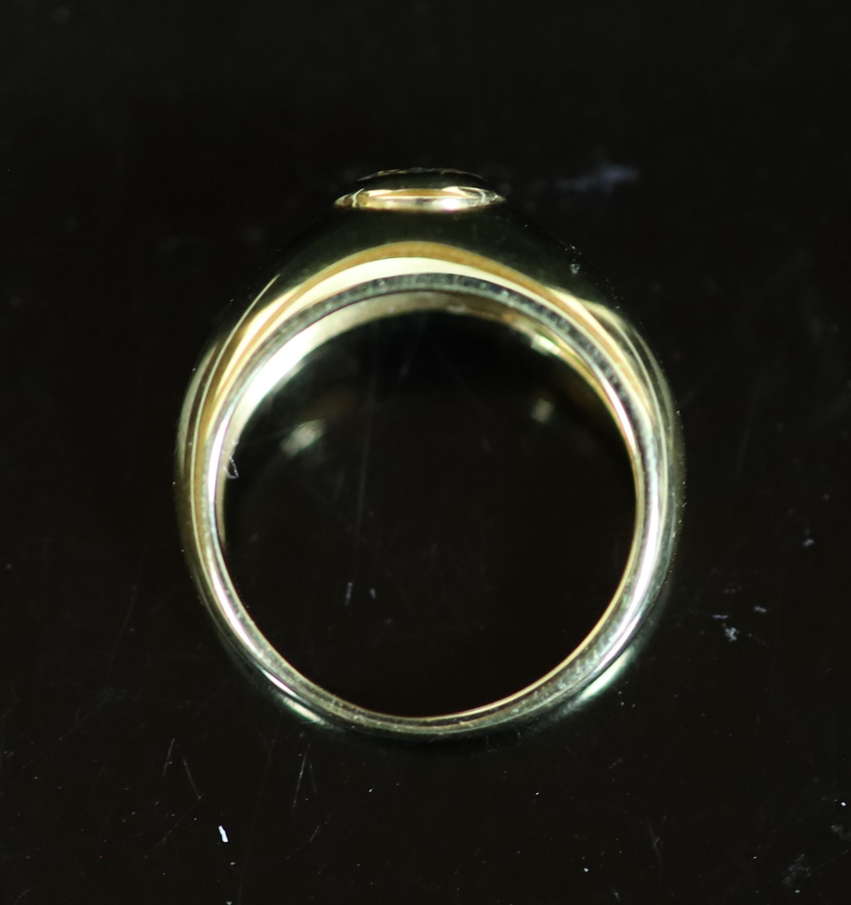 A Cartier 18ct gold and collet set solitaire diamond ring